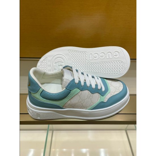 Gucci Monogram Trainers Upper and Sole in blue and white Side view of blue Gucci monogram trainer displayed next to its white textured rubber sole