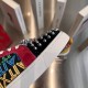 Close-up profile of the white rubber sole edge and red suede lace trim on Christian Louboutin trainers in multicolour and red