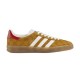 Gucci Gazelle Yellow Canvas Trainer Side Profile in yellow and white Side profile view of the yellow canvas Gucci Gazelle low top trainer featuring white stripes and red heel tab