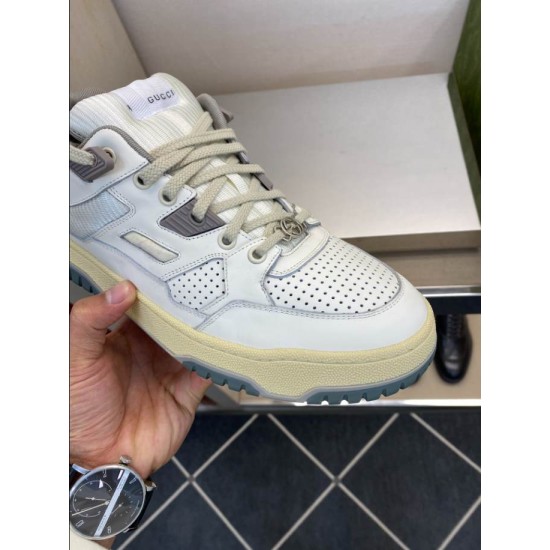 Gucci White Leather Trainer Perforated Toe Detail in white and grey Close-up front view of Gucci white leather trainer showing perforated toe box and lace charm in white and grey