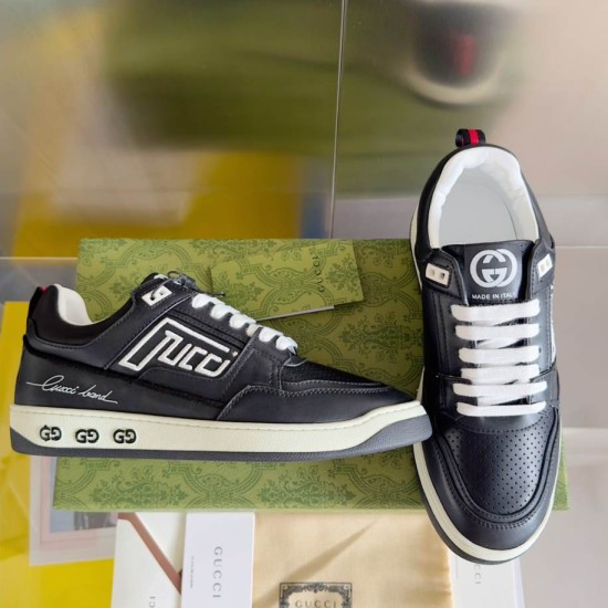 Gucci Black Leather Low Top Trainers side view with tongue logo detail in black and white