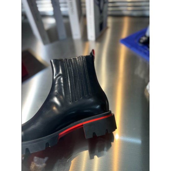 Christian Louboutin Men's Black Leather Chelsea Boots Panel Detail Close-up side view showing the stitched elastic side panel and red sole lining on Christian Louboutin Men's Black Leather Chelsea Boots.