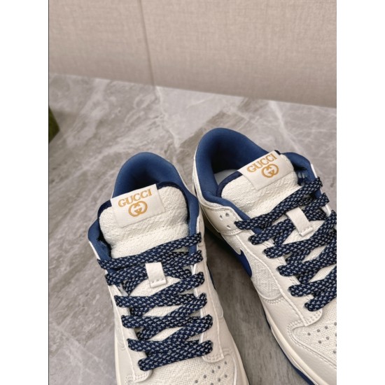 Gucci Low Top Leather Trainers In White And Blue Laces Detail Detailed view of tongue tag and patterned laces on Gucci Low Top Leather Trainers In White And Blue