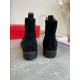 Christian Louboutin Men's Black Studded Suede Chelsea Boots Heel View Rear view of Christian Louboutin Men's Black Studded Suede Chelsea Boots showing pull tabs and red welt line