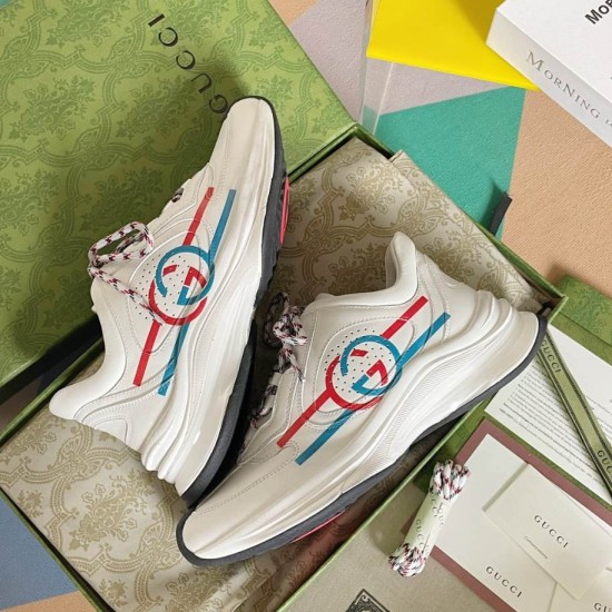 Gucci Run Leather Trainers In White Boxed View in white and red Gucci Run Leather Trainers In White lying inside open box highlighting red and blue side stripes