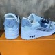 Heel View of L Bleached Monogram Denim Blue Low Top Trainers Rear view of L bleached monogram denim blue low top trainers highlighting heel branding