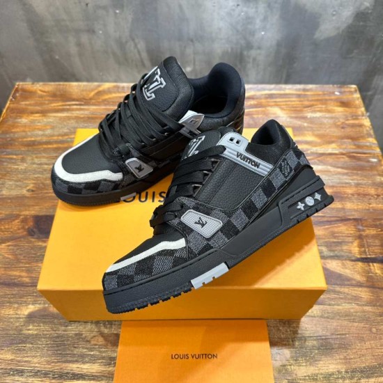 Top angled perspective showing laces and toe boxes of L Trainer Damier Denim Black Low Top Sneakers in black and grey