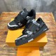 Top angled perspective showing laces and toe boxes of L Trainer Damier Denim Black Low Top Sneakers in black and grey
