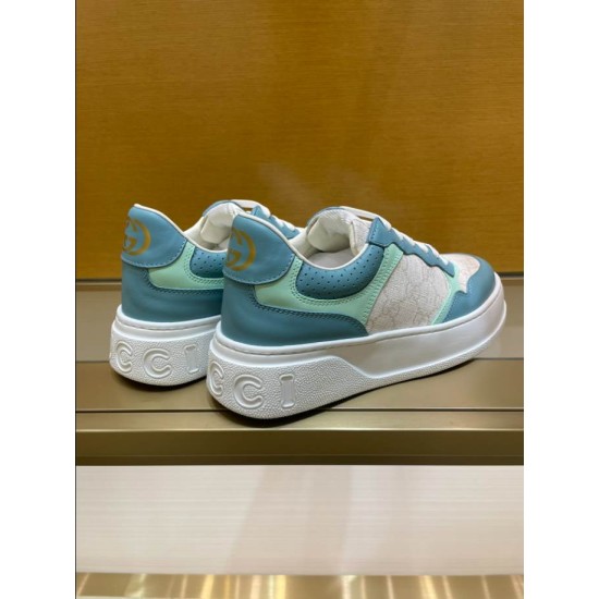 Gucci Monogram Trainers Rear Angle in blue and white Rear angle view of Gucci monogram trainers displaying the blue leather heel tab with gold logo in blue and white