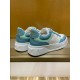 Gucci Monogram Trainers Rear Angle in blue and white Rear angle view of Gucci monogram trainers displaying the blue leather heel tab with gold logo in blue and white