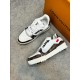 L Trainer Damier Leather White Brown Low Top Trainers Pair Arrangement Pair of L Trainer Damier leather white brown low top trainers arranged with one standing sideways and one top-down