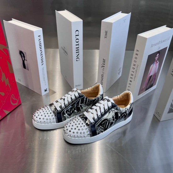 Christian Louboutin Graphic Printed Trainers Pair in black and white Pair of Christian Louboutin black and white printed trainers displayed on a grey surface