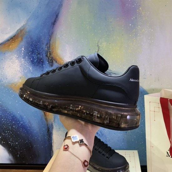 Alexander McQueen Black Transparent Sole Trainers Lateral Side Detail Alexander McQueen Black Transparent Sole Lace-Up Trainers close-up lateral side view