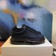 Alexander McQueen Black Transparent Sole Trainers Boxed Display Alexander McQueen Black Transparent Sole Lace-Up Trainers side view resting on packaging box