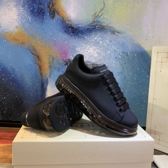 Alexander McQueen Black Transparent Sole Trainers Pair Display Alexander McQueen Black Transparent Sole Lace-Up Trainers pair display showing sole detail