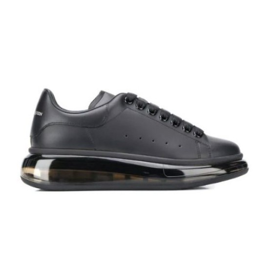 Alexander McQueen Black Transparent Sole Trainers Isolated Studio Shot Alexander McQueen Black Transparent Sole Lace-Up Trainers isolated studio side view