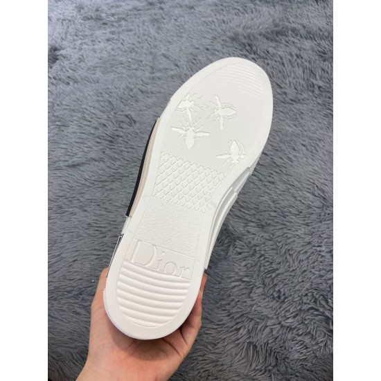 White rubber sole of Dior B23 high-top trainer showing bee motif tread