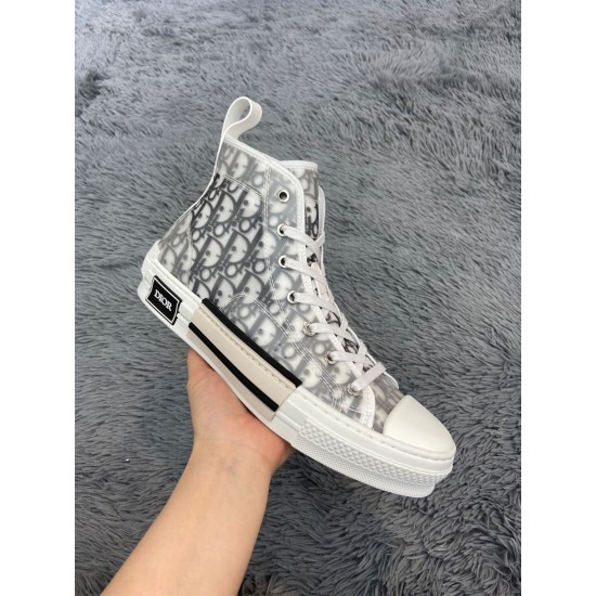 Angled view of Dior B23 high-top white trainer showing upper pattern and toe cap