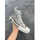 Angled view of Dior B23 high-top white trainer showing upper pattern and toe cap