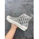 Medial side profile of Dior B23 high-top white trainer showing inner canvas pattern
