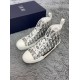 Pair of Dior B23 high-top white trainers positioned angled side by side