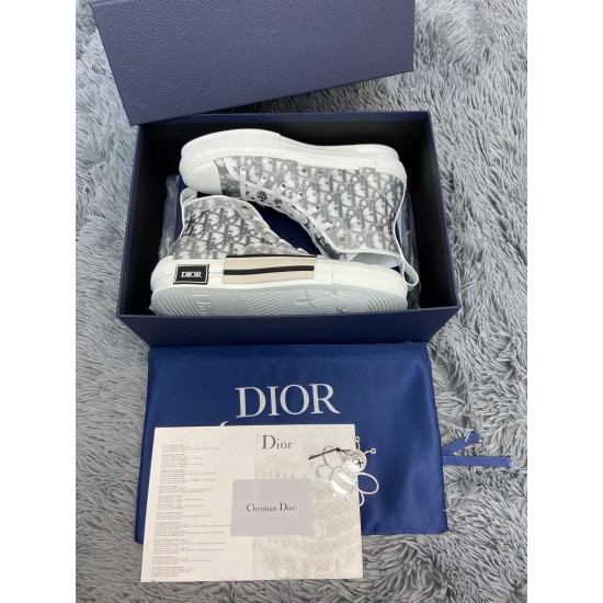 Dior B23 high-top white trainers packaged in signature blue box with accessories