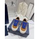 Dior B33 Trainers Front View with Blue Laces in brown and cream Front elevated view of Dior B33 brown oblique trainers showing royal blue laces in brown and cream