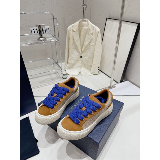 Dior B33 Oblique Jacquard Trainers Pair View in brown and cream Pair of Dior B33 brown cream trainers with blue fuzzy laces arranged on box