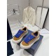 Dior B33 Oblique Jacquard Trainers Pair View in brown and cream Pair of Dior B33 brown cream trainers with blue fuzzy laces arranged on box
