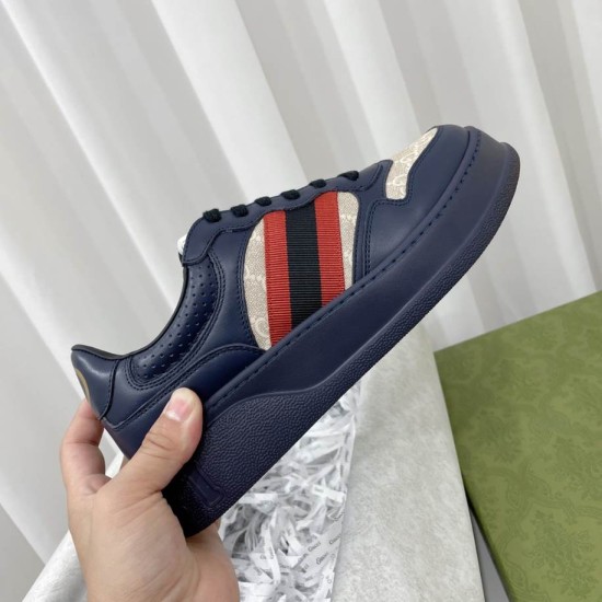 Gucci Dark Blue Trainers Lateral Profile Handheld lateral view highlighting the side web stripe and chunky midsole in dark blue