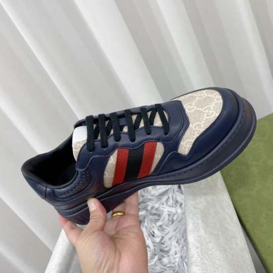 Gucci Dark Blue Trainers Handheld View Handheld view showcasing the front toe box and lace closure design in dark blue