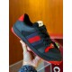Gucci black and red web low top trainer close-up held view