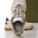 Top-down close-up view of shoe opening, laces, and internal branding label in white and brown