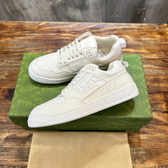 Gucci White Leather Low Top Trainers Pair Profile in white and green Gucci White Leather Low Top Trainers pair angled profile view on green box