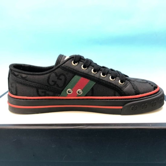 Gucci Off The Grid Black Low Top Trainers Medial View in black and red Medial side profile of black Gucci trainer featuring red stripe and side eyelets