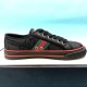 Gucci Off The Grid Black Low Top Trainers Medial View in black and red Medial side profile of black Gucci trainer featuring red stripe and side eyelets
