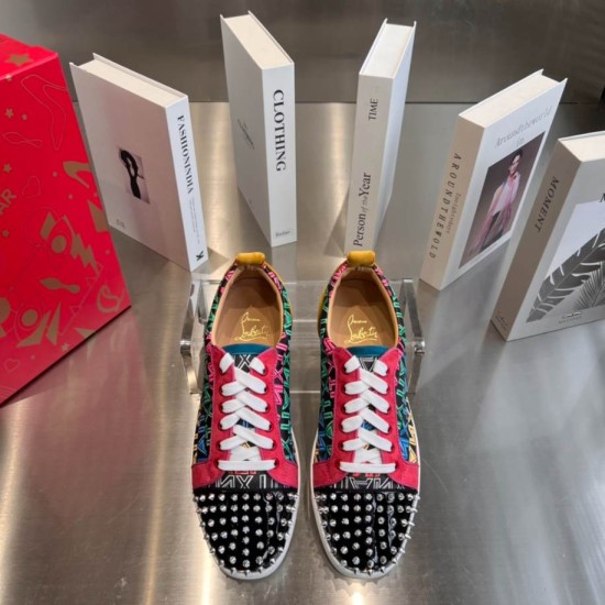 Top-down pair view of Christian Louboutin Louis Junior Spikes multicolour trainers with white laces in multicolour and red