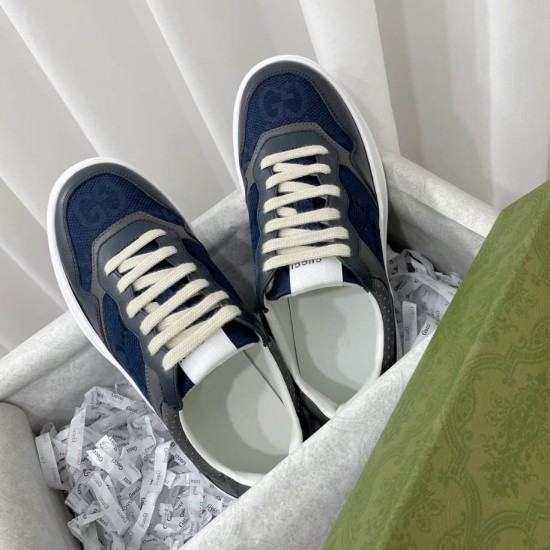 Overhead shot of the Gucci grey and blue chunky trainers resting inside their white packaging box