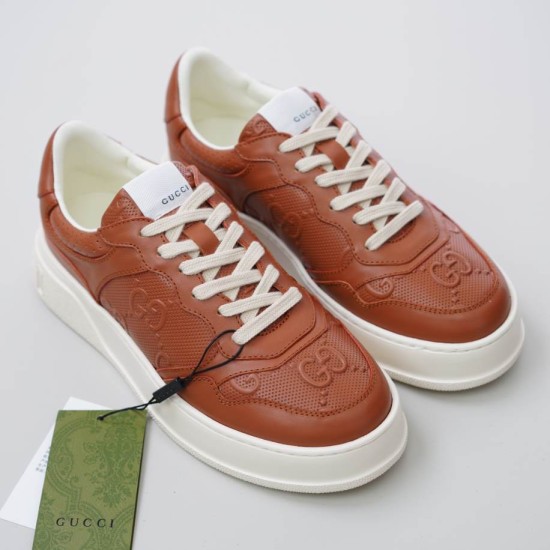 Pair of Gucci brown jumbo GG embossed trainers viewed from above