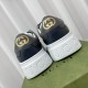 Rear view highlighting the gold-tone GG heel logos and embossed white midsoles on the Gucci trainers in grey and blue