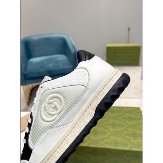 Gucci Mac80 Woven Panel Detail in off-white and black Close-up view of side woven panel and logo stitching on off-white leather trainer in off-white and black