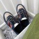 Gucci Dark Blue Trainers Top View Top-down view of dark blue lace-up trainers with monogram canvas toe panels