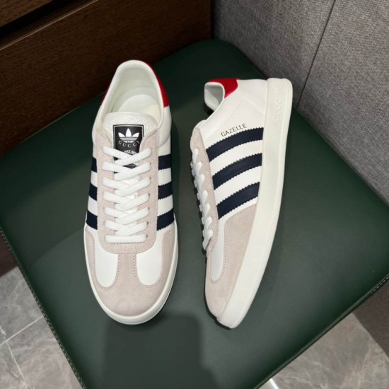 Top View of Gucci Gazelle White Trainers in white and black Top-down view of Gucci Gazelle white leather trainers with light grey suede accents in white and black