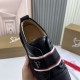 Top-down view inside Christian Louboutin Adolescenza black trainer showing branded inner lining in black and red