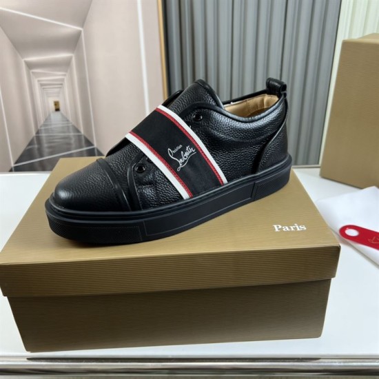 Single Christian Louboutin Adolescenza black leather slip-on trainer resting on top of a branded shoe box in black and red