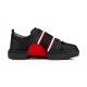 Christian Louboutin Adolescenza Leather Slip-On Trainers in black studio side profile showing red arch detail