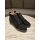 Pair of Christian Louboutin black high top trainers showing top front angle