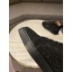 Close-up of black crystal embellishments and toe cap on Christian Louboutin trainer