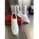 Christian Louboutin Louis Junior White Trainers Laced Perspective Front high-angle perspective of Christian Louboutin Louis Junior white trainers with laces and box background