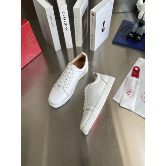 Christian Louboutin Louis Junior White Leather Trainers Angled Pair Angled pair view of Christian Louboutin Louis Junior white leather trainers displaying red sole accent